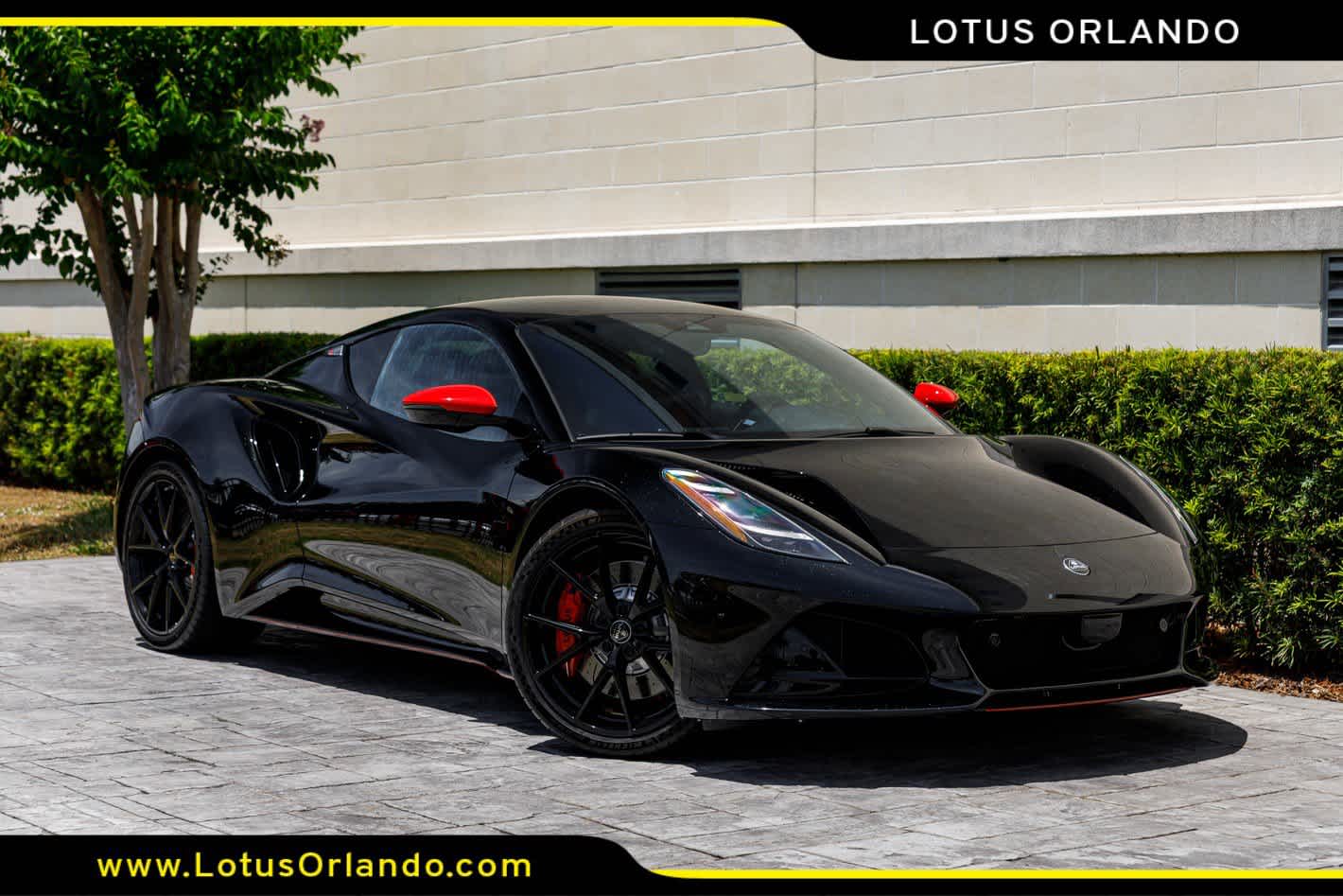 2026 Lotus Emira V6 SE Racing Line in Cosmos Black — front three-quarter view